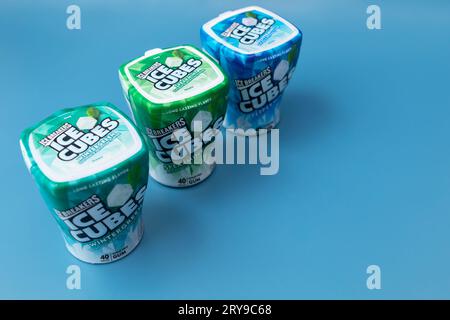 Few Packages Of Ice Cubed Bubble Gum. Healthy Sugar-Free Xylitol Chewing Cubes With Different Flavor on Blue Background. Healthy Teeth, Beautiful Stock Photo