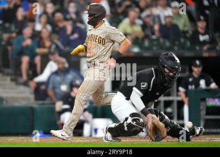 San Diego Padres' Matthew Batten, right, is tagged out by Philadelphia  Phillies second baseman Edmundo Sosa after trying to steal second during  the fifth inning of the first baseball game in a