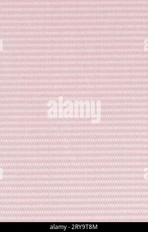 A close-up of pink plastic with a bumpy texture. The texture is ...