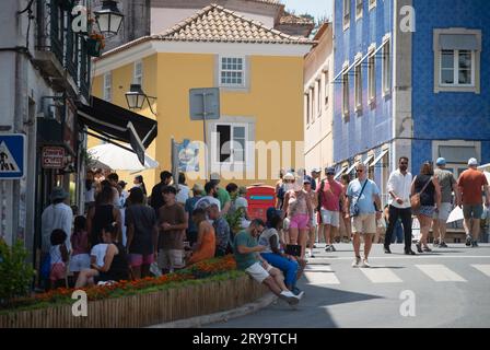 The Historic center of Sintra, Portugal, corner of Praca DA Republica and Rua Visconde Monserrate streets, Crowded with tourists.  It is estimated that 20 million tourists visit the UNESCO World Heritage ranked Sintra every year. Stock Photo