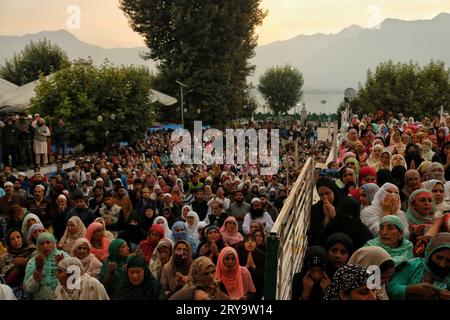 September 29, 2023, Srinagar Kashmir, India : people pray as the head cleric (unseen) displays the holy relic on the occasion of Mawlid-un-Nabi or Prophet Muhammad's (PBUH) birth anniversary in Dargah Hazratbal shrine in Srinagar. Hundreds of thousands of Muslims from all over Kashmir visit the Hazratbal shrine in Srinagar to pay obeisance on the birth anniversary of Prophet Mohammed (PBUH) . The shrine is highly revered by Kashmiri Muslims as it is believed to house a holy relic of the Prophet Mohammed (PBUH). The relic is displayed to the devotees on important Islamic days such as the Mawlid Stock Photo