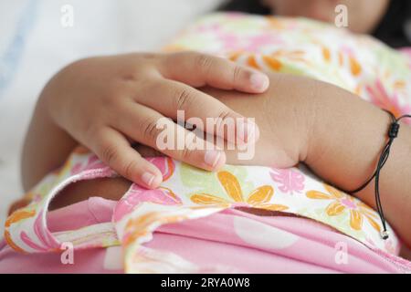 a child sleeping in bed, selective focus on hand  Stock Photo