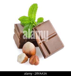 Closeup detail of chocolate parts and mint leaves on white background ...