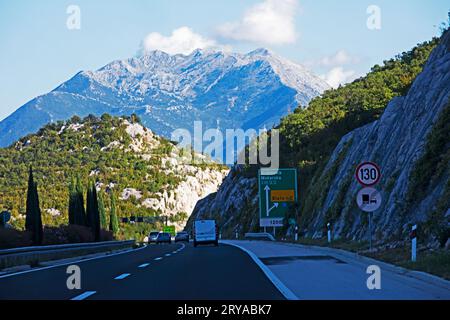 road in Croatia through the mountain fork. Traveling and relaxing by car Stock Photo