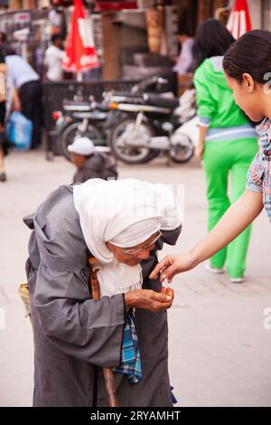 elderly beggar lady in Marrakech Morocco March 2012 Stock Photo