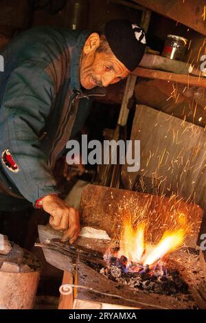 Berber local lighting fire in Morocco March 2012 Stock Photo