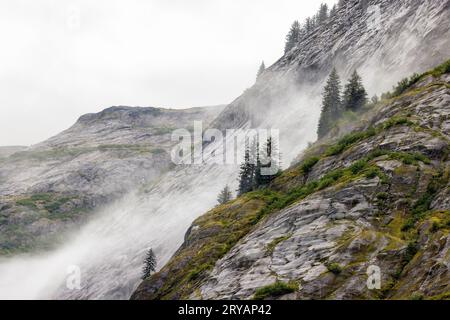 Dramatic foggy landscape in Tracy Arm Fjord near Juneau, Alaska, USA Stock Photo