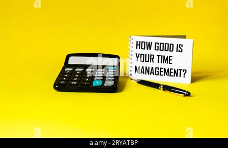 HOW GOOD IS YOUR TIME MANAGEMENT text on notepad and yellow background Stock Photo