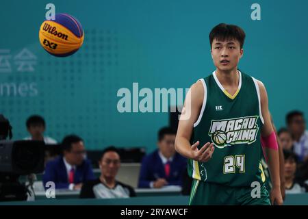 Huzhou, China's Zhejiang Province. 30th Sep, 2023. Yang Xuan of China's Macao competes during Men's Qualifications to Quarterfinal of 3X3 Basketball between Japan and China's Macao at the 19th Asian Games in Huzhou, east China's Zhejiang Province, Sept. 30, 2023. Credit: Chen Bin/Xinhua/Alamy Live News Stock Photo