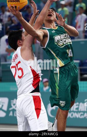 Huzhou, China's Zhejiang Province. 30th Sep, 2023. Zeng Pucheng (R) of China's Macao competes during Men's Qualifications to Quarterfinal of 3X3 Basketball between Japan and China's Macao at the 19th Asian Games in Huzhou, east China's Zhejiang Province, Sept. 30, 2023. Credit: Chen Bin/Xinhua/Alamy Live News Stock Photo