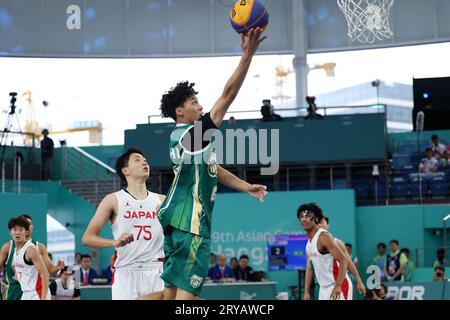 Huzhou, China's Zhejiang Province. 30th Sep, 2023. Ho Hou In of China's Macao competes during Men's Qualifications to Quarterfinal of 3X3 Basketball between Japan and China's Macao at the 19th Asian Games in Huzhou, east China's Zhejiang Province, Sept. 30, 2023. Credit: Chen Bin/Xinhua/Alamy Live News Stock Photo