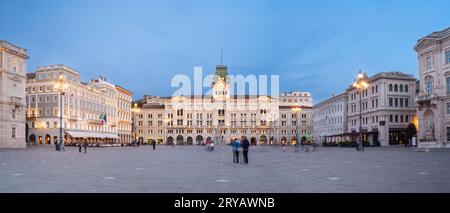 Dusk's Sublime Glow - City Hall's Elegance Shines on Piazza dell'Unità in Trieste, Italy, Stock Photo