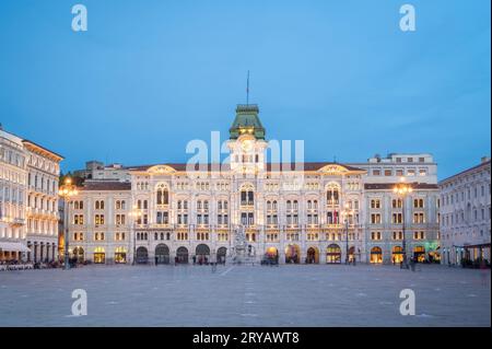 Dusk's Sublime Glow - City Hall's Elegance Shines on Piazza dell'Unità in Trieste, Italy, Stock Photo