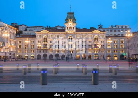 Dusk's Sublime Glow - City Hall's Elegance Shines on Piazza dell'Unità in Trieste, Italy, Stock Photo