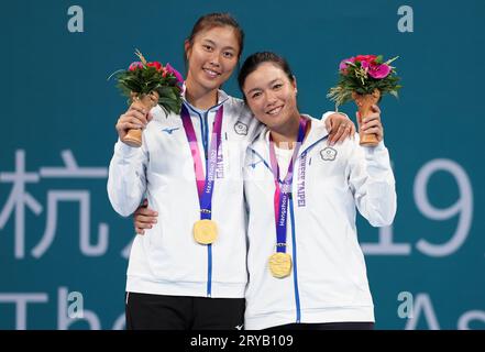 Hangzhou, China's Zhejiang Province. 30th Sep, 2023. Gold medallists Chan Hao-ching(L)/Chan Yung-jan of Chinese Taipei attend awarding ceremony of women's doubles of tennis at the 19th Asian Games in Hangzhou, east China's Zhejiang Province, Sept. 30, 2023. Credit: Meng Chenguang/Xinhua/Alamy Live News Stock Photo