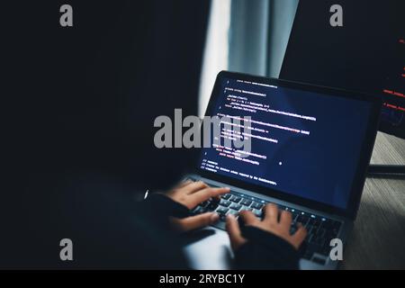 Person, hands and hacker on laptop at night in cybersecurity, coding malware or software at home. Hacking, working late and typing on computer in Stock Photo