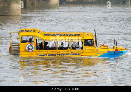 London Duck Tours limited DUKW wartime amphibious vehicle underway on the River Thames in Vauxhall, with passengers onboard. Fully loaded Stock Photo
