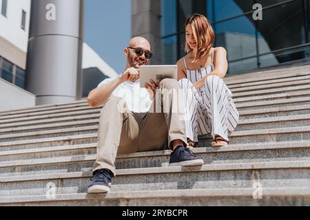 Creative team of e-commerce professionals discussing strategies for online retail and profit growth. Stock Photo