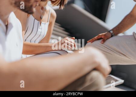 Creative Business Partners Discussing E-Commerce Strategies for Profit Growth and Targeting Audience with Technology Stock Photo