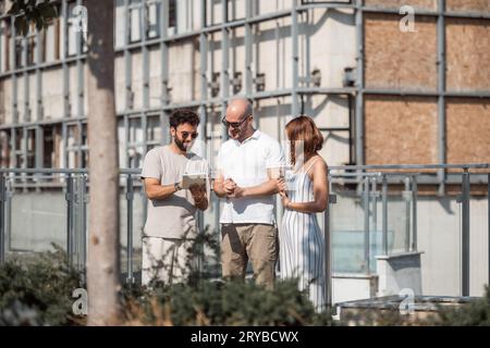 Successful Urban Architecture Team Collaborating on Modern Building Design Stock Photo