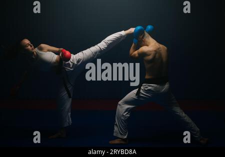 Good looking karate friends fight while doing karate pose at the karate ...