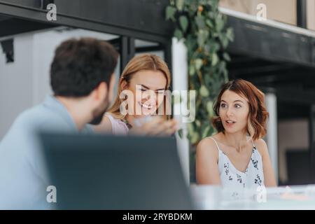 Diverse marketing team strategizing campaigns, analyzing data and optimizing online advertising in a modern office. Expertise in targeting, teamwork, Stock Photo