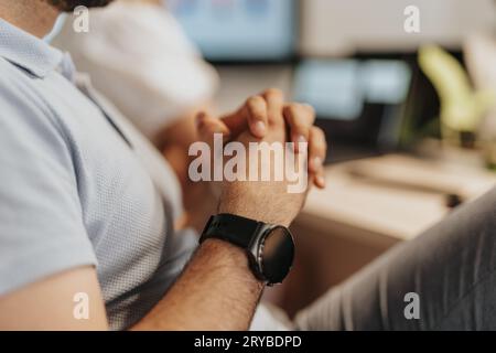 A diverse business team analyzing statistics and discussing profit growth in an office workspace. They demonstrate teamwork and leadership in planning Stock Photo