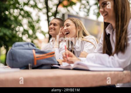 Happy students having fun and laughing after classes Stock Photo