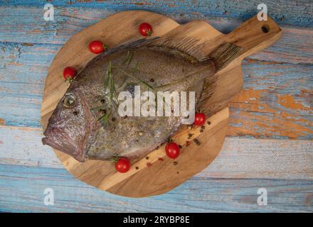 Saint-Pierre Seafish, Zeus Faber, John Dory, Pez de San Pedro, fish, isolated on cutting board background Stock Photo