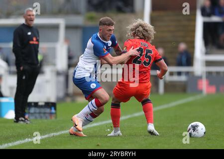 Oliver Finney of Hartlepool United battles with Aaron Kuhl of Dorking ...