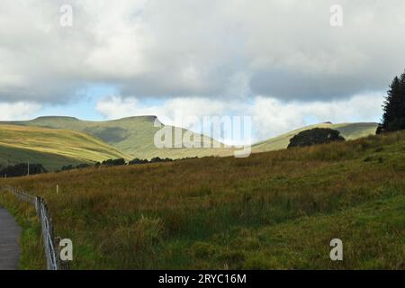 Corn Du, Pen y Fan and Cribyn all in the Central Brecon Beacons  - the mountains with sun shining on them with autumn drawing in close Stock Photo
