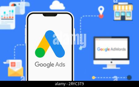 A high-detail close-up of a smartphone screen displaying the Google Ads logo and campaign management interface. This editorial image illustrates the d Stock Photo