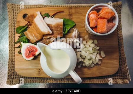 Ingredietns to preparing the cod fish fillet with orange soup with sweet potatoes and other tasty vegetables - photo from above. Stock Photo