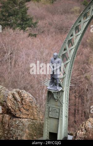 Donnersberg, Germany - April 9, 2021: Statue of a man on the side of Adlerbogen, Eagle Arch, on a spring day in Germany. Stock Photo