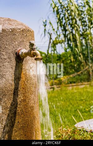 Old rusty faucet leaks Stock Photo - Alamy