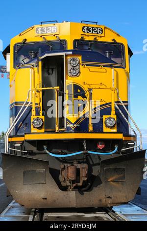 Blue and yellow tractor engine of the Alaska Railroad in Anchorage, ready for departure to Denali Na Stock Photo