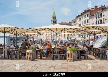 Venice, Italy - May 31 2023: Outdoor restaurant cafe in Venice. Stock Photo