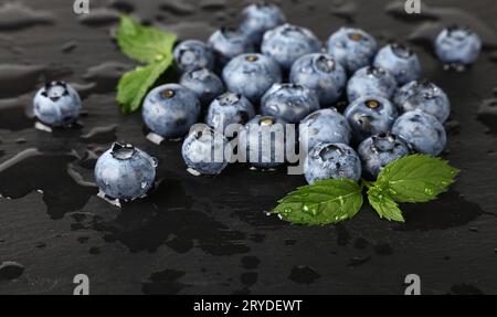 Close up washed fresh blueberries on black board Stock Photo