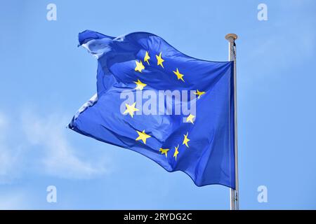 Close up flag of EU waving in wind over blue sky Stock Photo