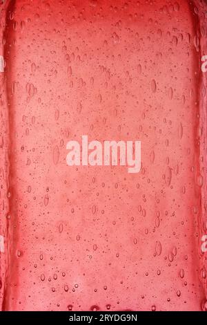 Red glass background texture with air bubbles Stock Photo