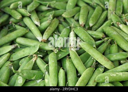 Close up green peas pods on retail display Stock Photo