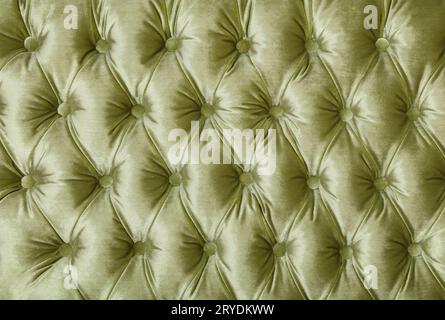 Green capitone tufted fabric upholstery texture Stock Photo