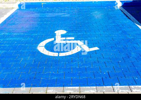 Wheelchair blue par king spot Stock Photo