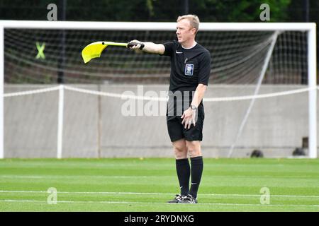 Swansea, Wales. 30 September 2023. Assistant Referee Kevin Slade raises his flag for offside during the Under 18 Professional Development League game between Swansea City and Charlton Athletic at the Swansea City Academy in Swansea, Wales, UK on 30 September 2023. Credit: Duncan Thomas/Majestic Media. Stock Photo