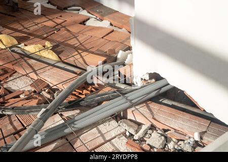 Wire mesh steel and piping for electrical wiring on floor Stock Photo