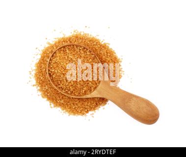 Close up scoop of brown cane sugar on white Stock Photo