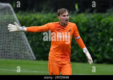 Swansea, Wales. 30 September 2023. Goalkeeper Ewan Griffiths of Swansea City complains to the assistant referee during the Under 18 Professional Development League game between Swansea City and Charlton Athletic at the Swansea City Academy in Swansea, Wales, UK on 30 September 2023. Credit: Duncan Thomas/Majestic Media. Stock Photo