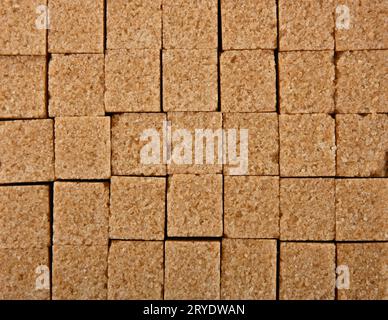 Background texture pattern of brown sugar cubes Stock Photo