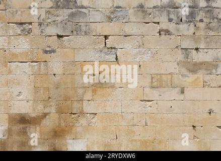 Wall of white travertine adarce stone bricks Stock Photo