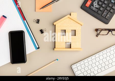 Work at home concept. Desk smart phone, keyboard and office supplies Stock Photo
